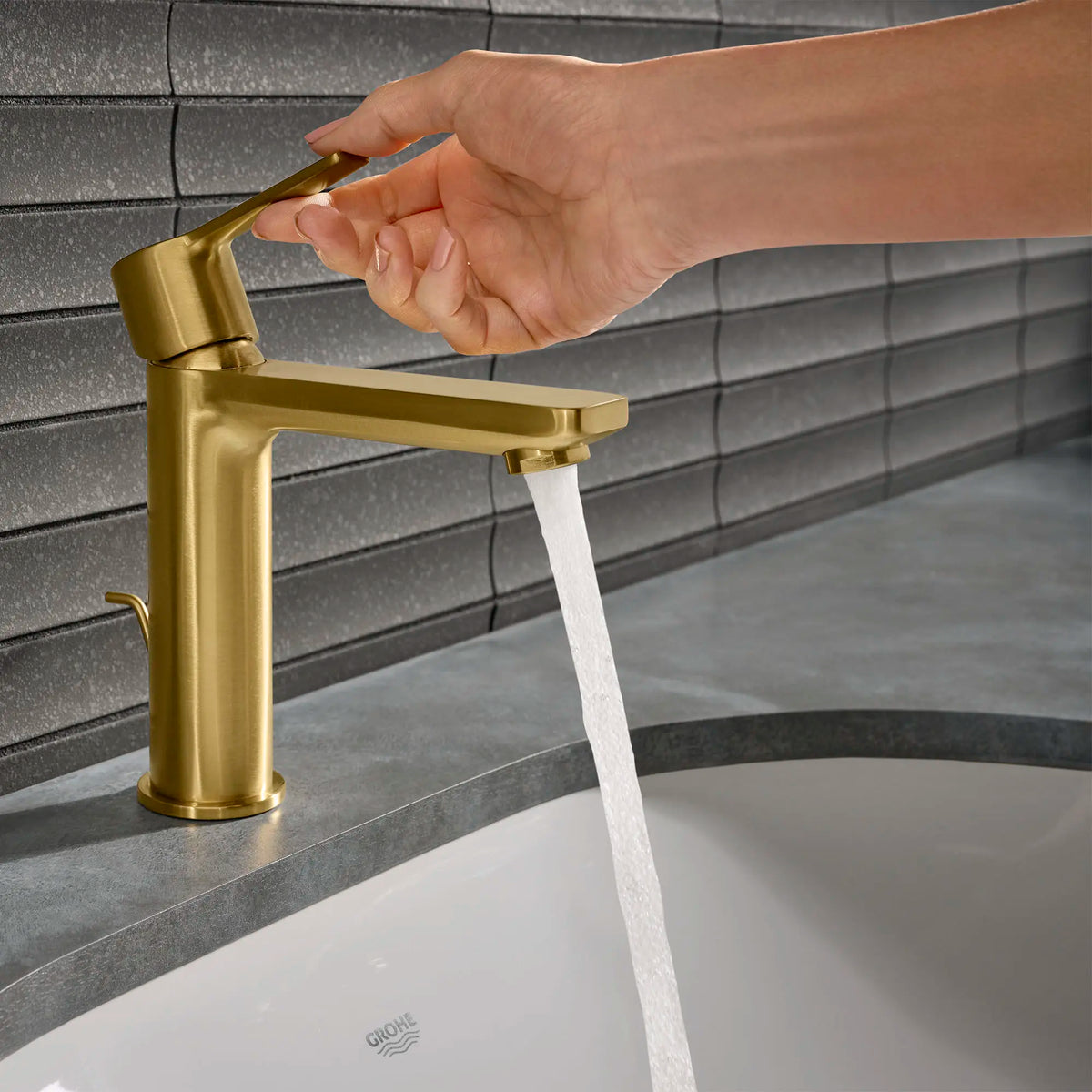 Single Hole Single-Handle S-Size Bathroom Faucet 4.5 L/min (1.2 gpm) // BRUSHED COOL SUNRISE // 164213_Lineare_Lifestyle_23794GNA_0001_May2023_0_CDNwebp_c3379521-7d35-4242-84cc-66f481cb716b.webp